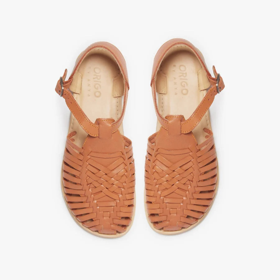 Pair of tan huarache sandals with open toe and braided woven upper.