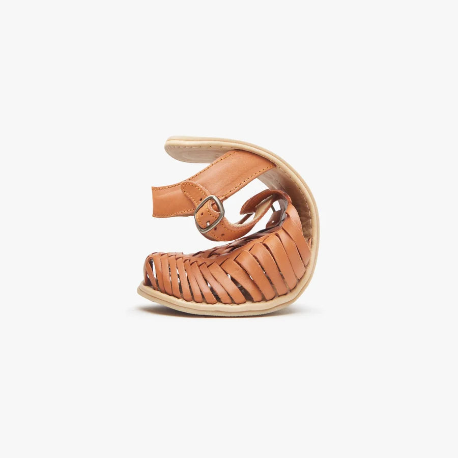 Tan Origo huarache sandal with adjustable ankle strap and woven upper.