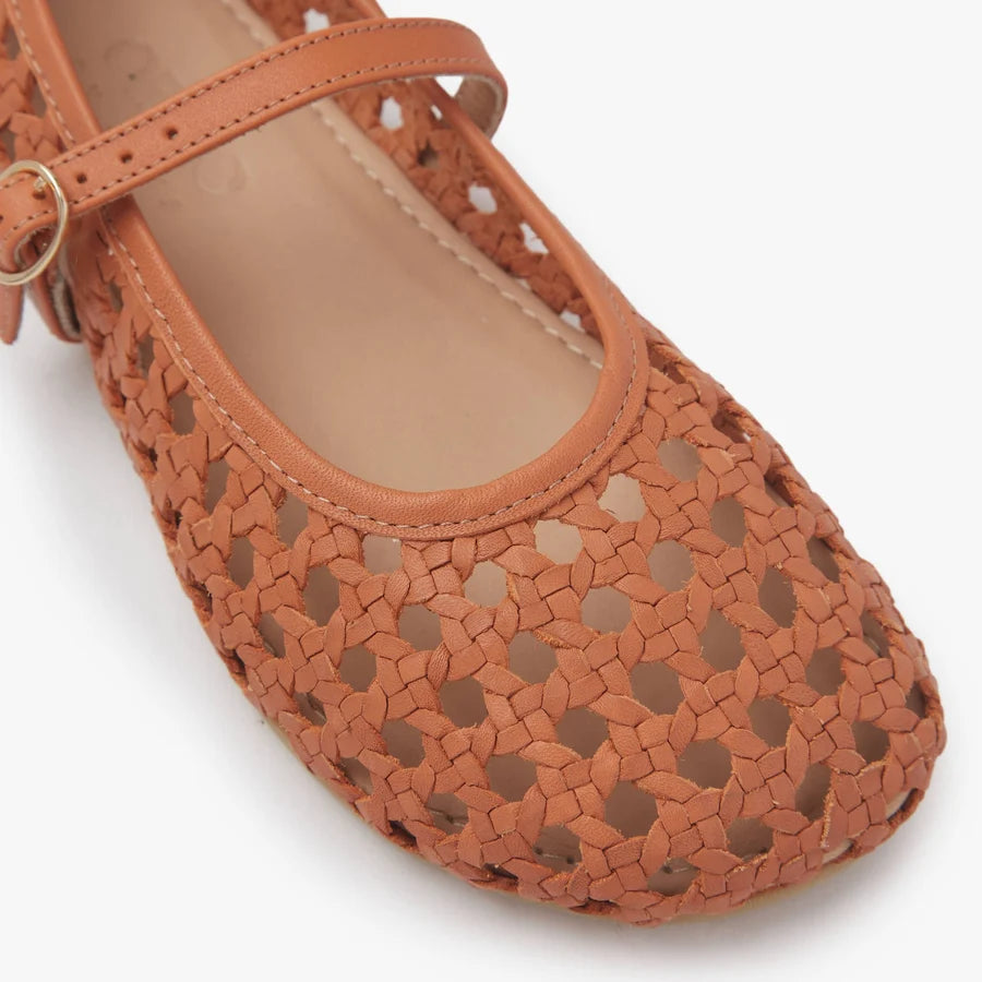 Close-up of rust-brown woven ballet flat with strap opening and cushioned footbed
