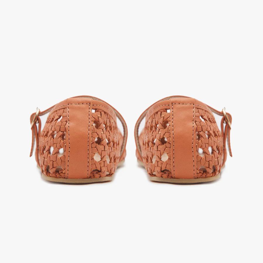 Pair of rust-brown woven ballet flats with ankle strap and small tassel ties