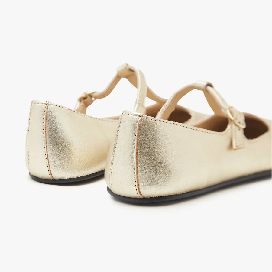 Women's T-strap ballet flat, metallic gold, rear view showing heel strap loops